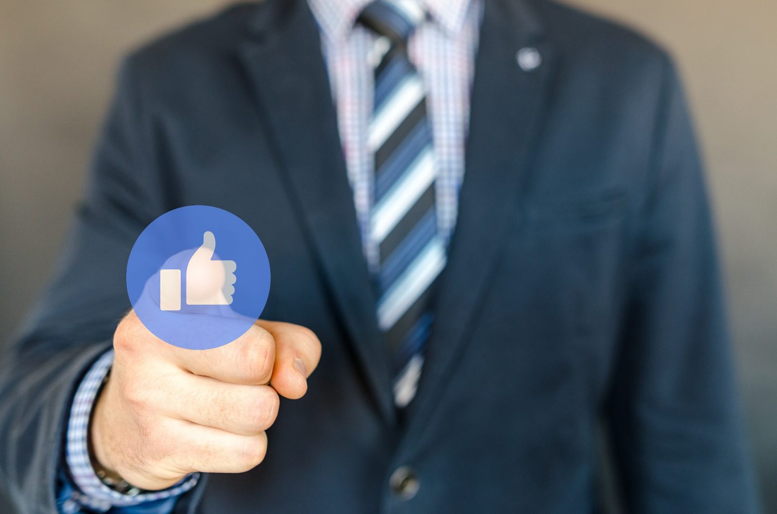 man with a facebook like button
