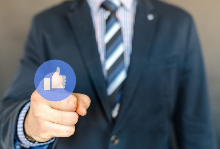 man with a facebook like button