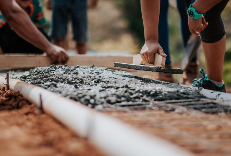 worker laying concrete