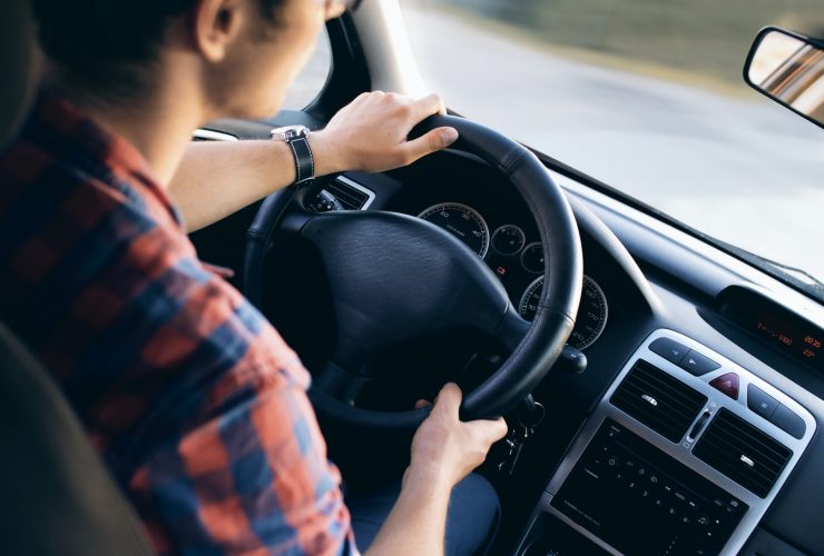 man driving a car