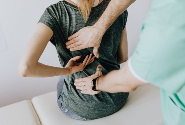 treating back pain on a patient