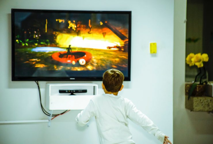 kid looking at a tv screen